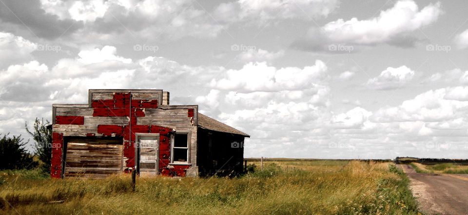 red abandoned building in the middle of no where