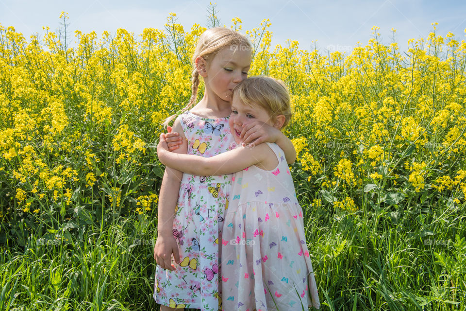 Girl embracing her elder sister