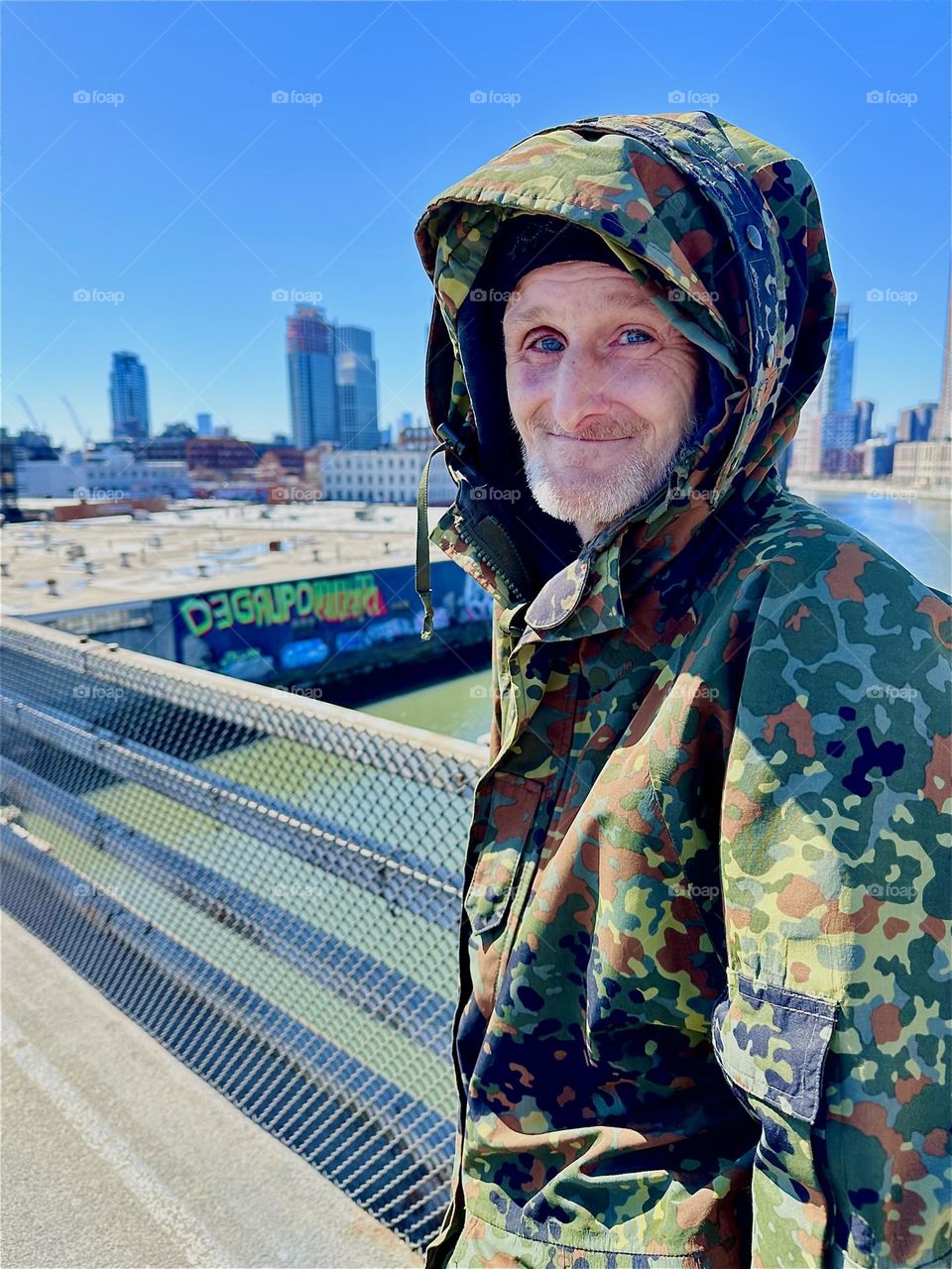 This is “Timothy Trespas”, my partner in life and good friend for nearly 17 years standing on the “Pulaski Bridge” at “Newtown Creek” that connects LIC, Queens to “Greenpoint”, Brooklyn on a sunny afternoon in March 2024. Hypnotic Productions