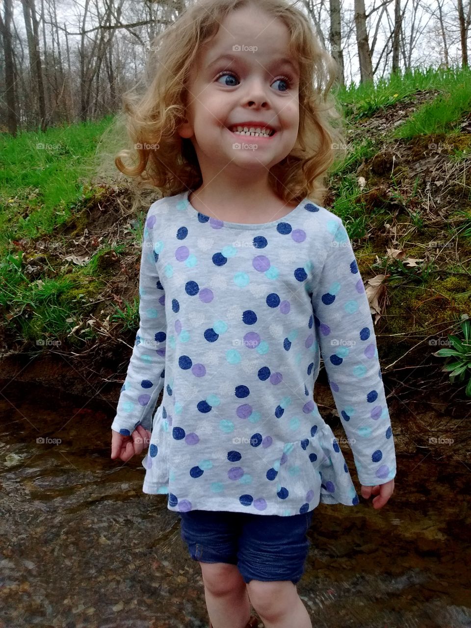 Cute girl in spring creek