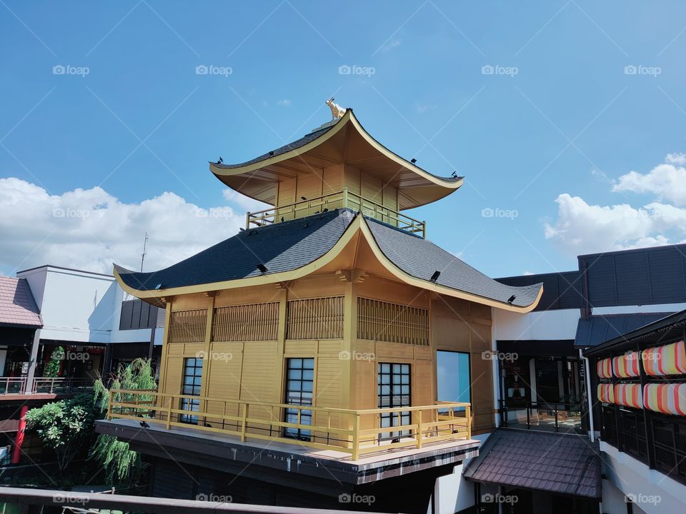 The yellow Japanese style building is built in a Japanese style mall.