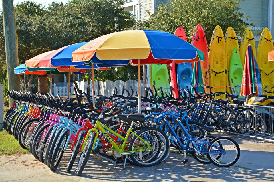 Multiverse - Colorful bikes, kayaks, umbrellas and chairs for rent to the beach goers and tourists 