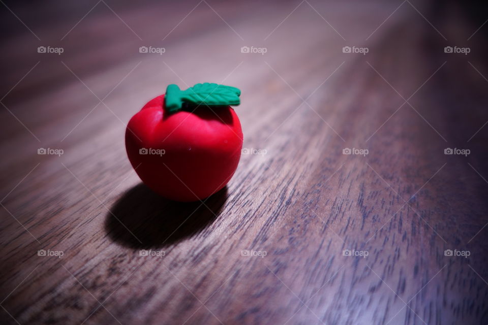 An apple on the table.  