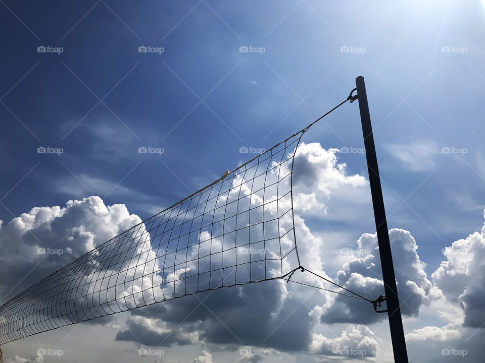 Enjoying the last summer days playing beach volleyball 