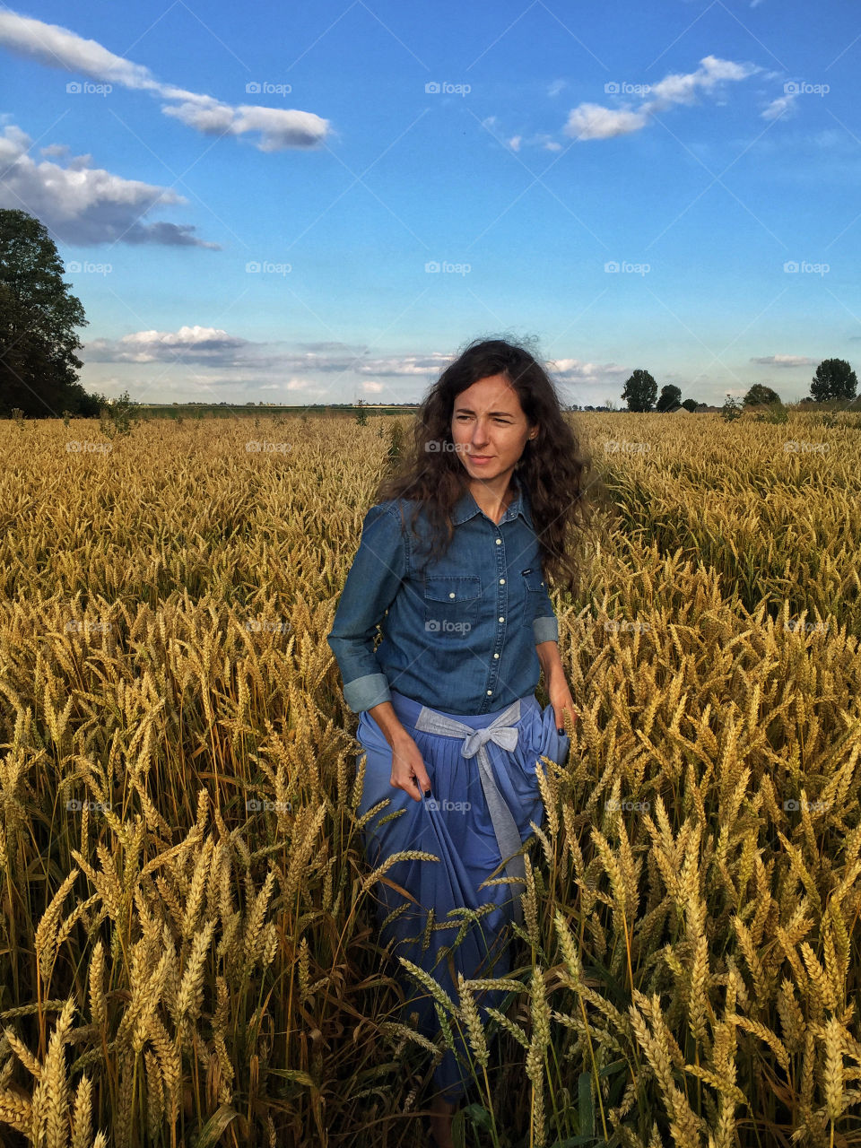 Young woman walking in field