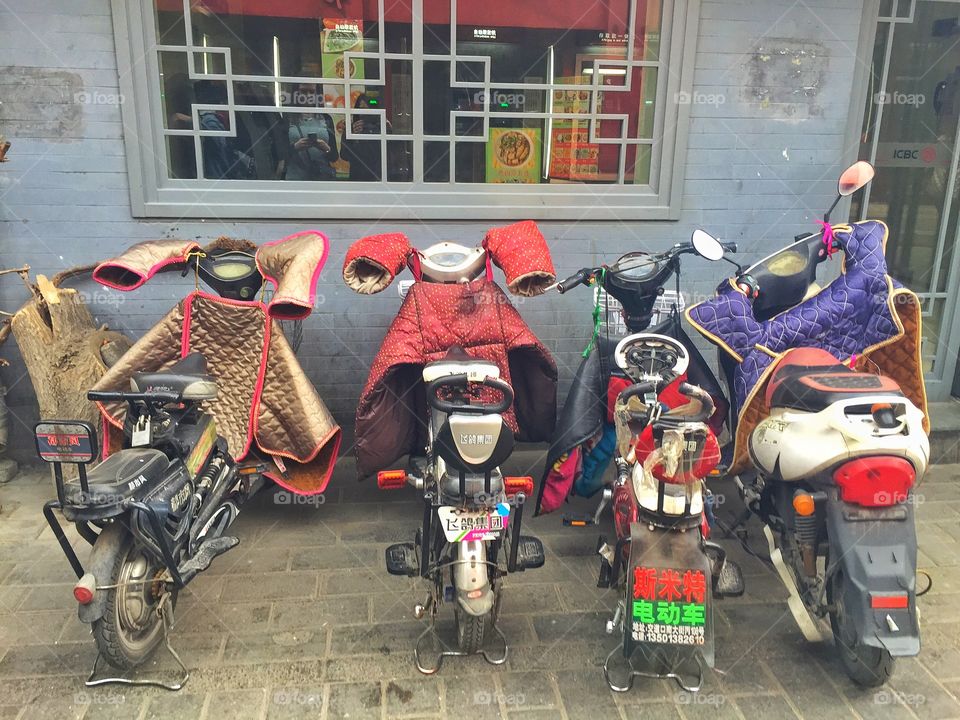 Chinese scooter parked on street