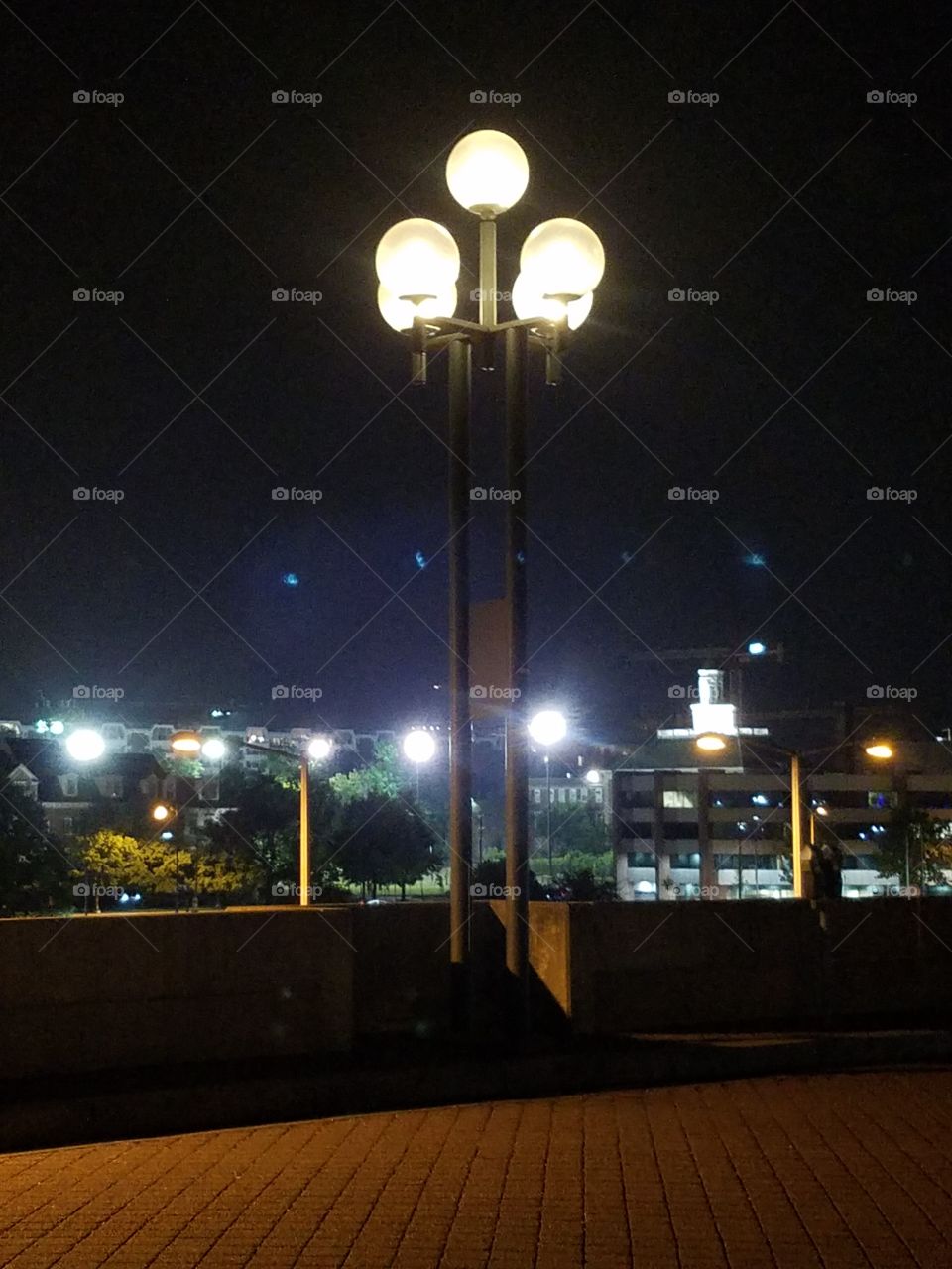 darkness creeps over Washington dc and the street lamps light the night