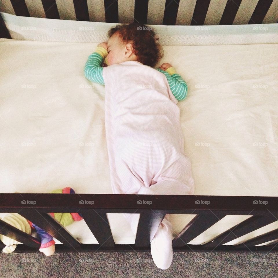 Baby Sleeping Sideways in a Crib