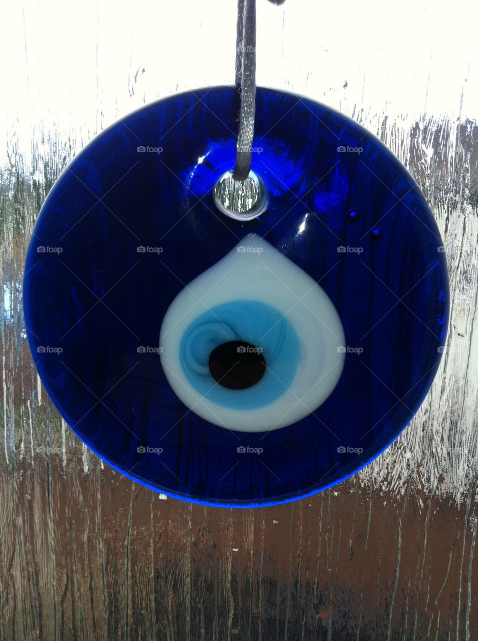 blue glass eye luck by jeanello