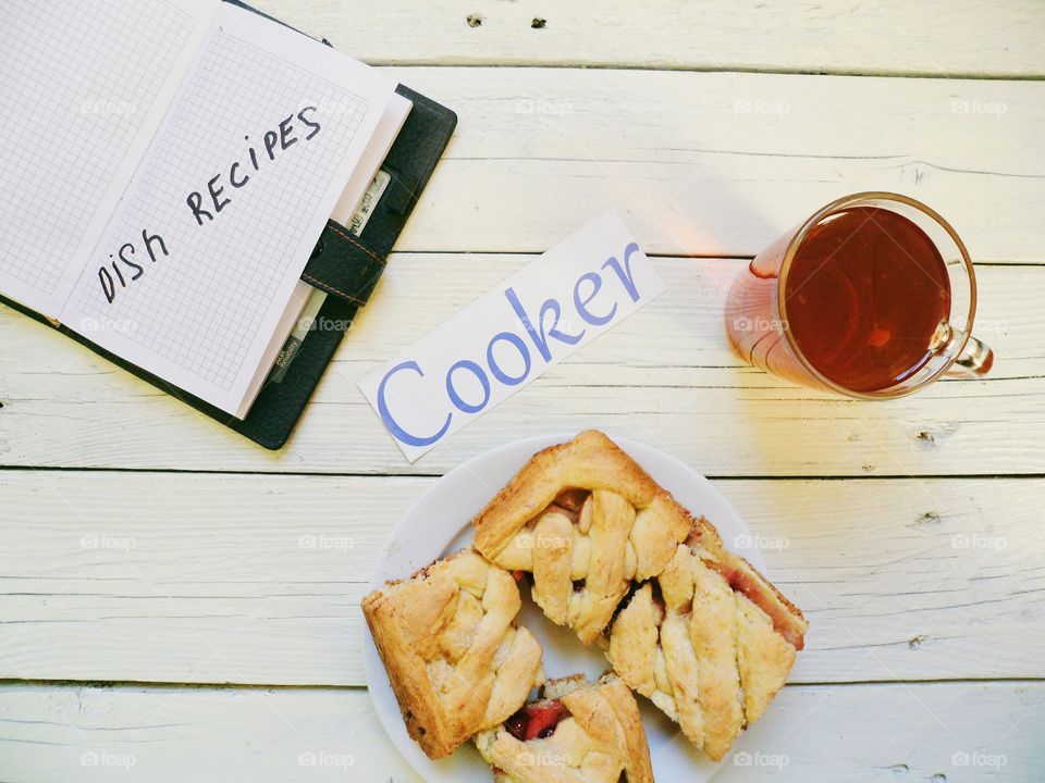 cup of tea, home-made cake and notebook