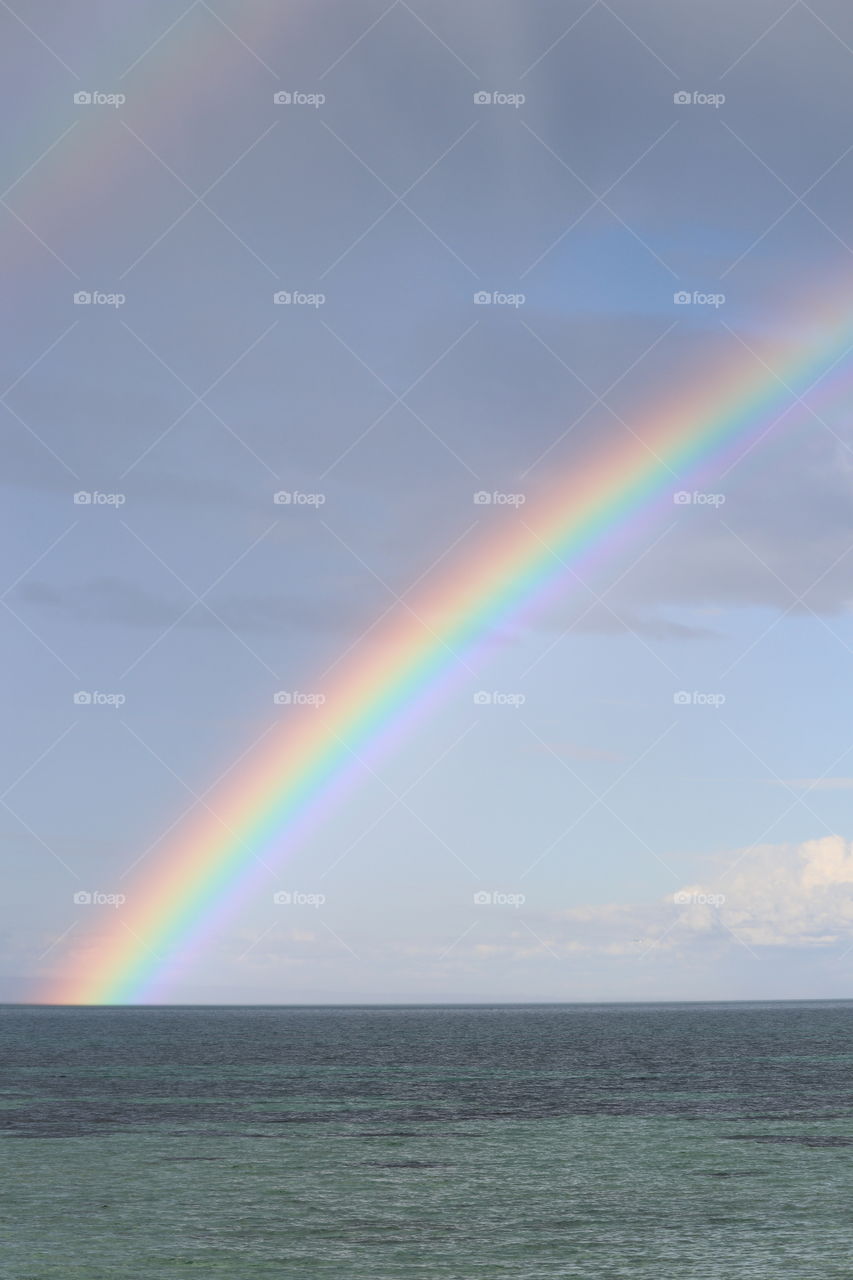 Rainbow in dark sky over ocean spence gulf Eyre peninsula south Australia 