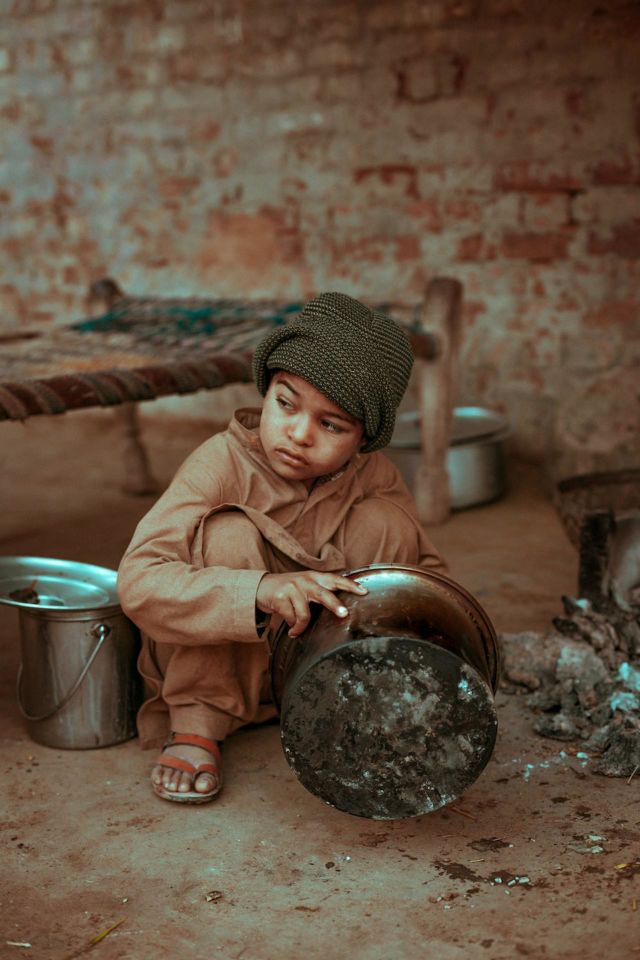 In this photo it is told that a boy who is without parents and is cooking food from his own memories.