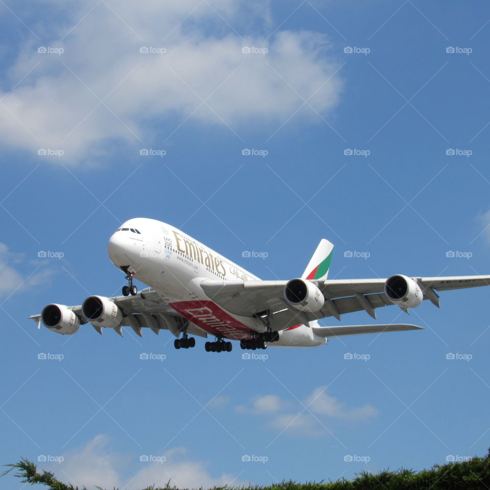An emirates airbus A380 landing at London's Gatwick airport.