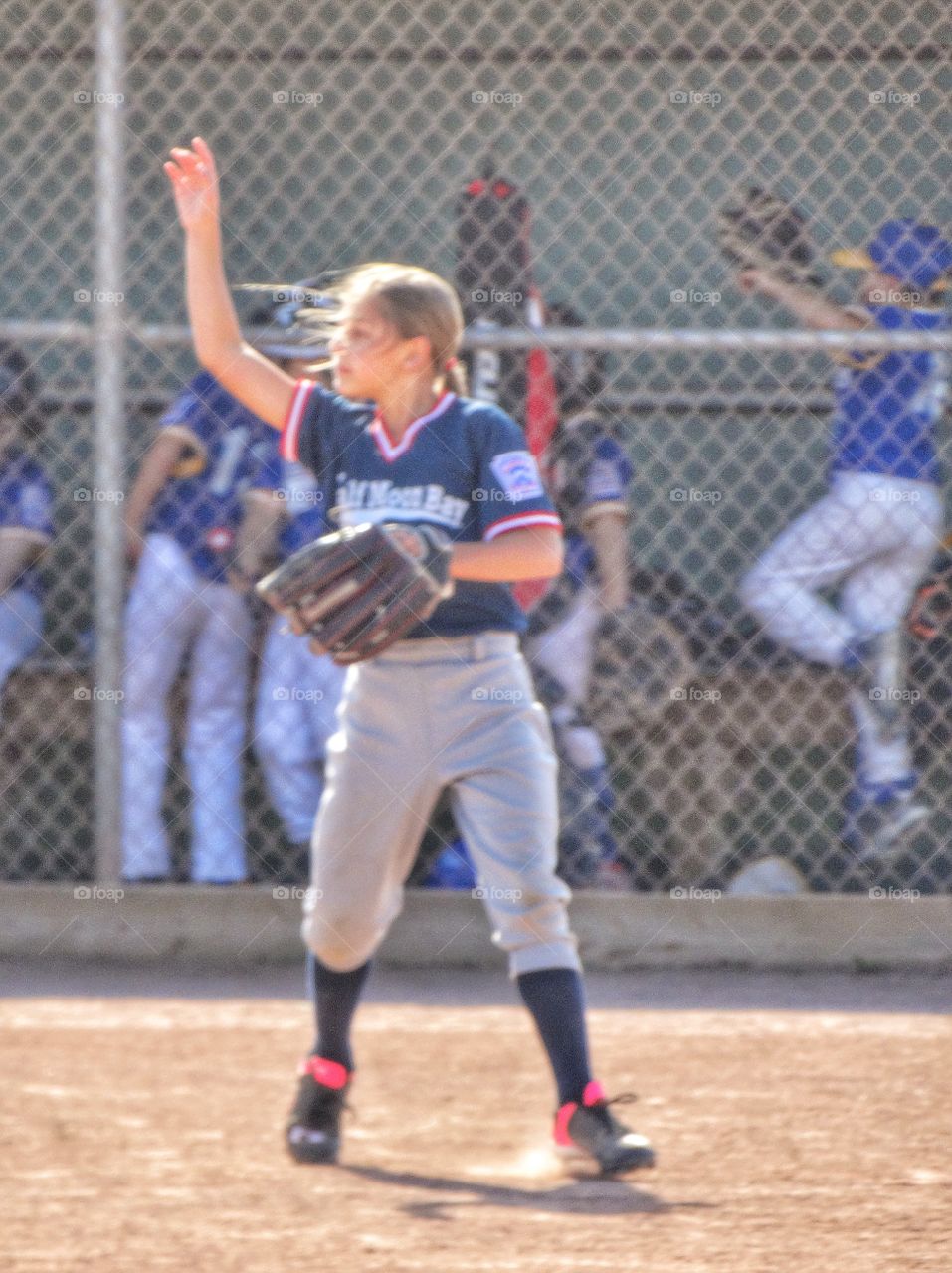 Girl Playing Little League Baseball