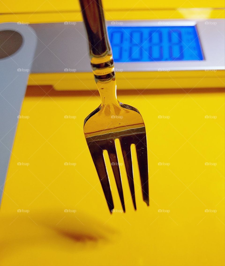 No ordinary golden  fork, weigh scale