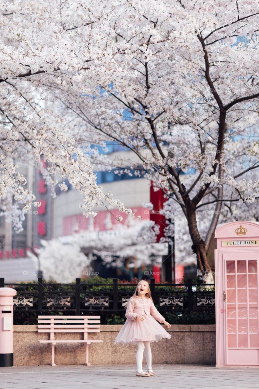 Cute little Caucasian girl enjoying spring 