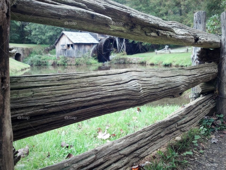 Old mill behind the fence