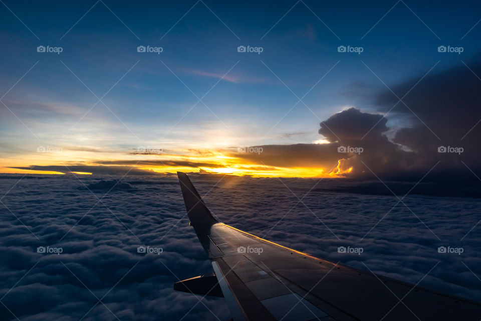 Sunset on airplane flying