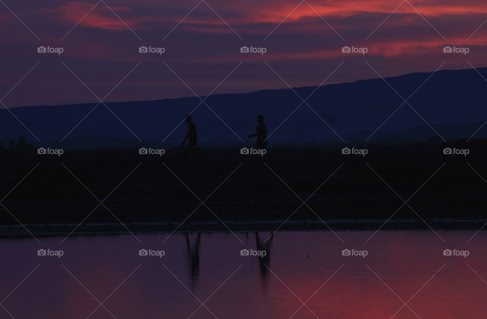 A friendship of two for get the home. Two male until the late afternoon captured when the sunset's came. Reflection of two shown interest into the eyes.