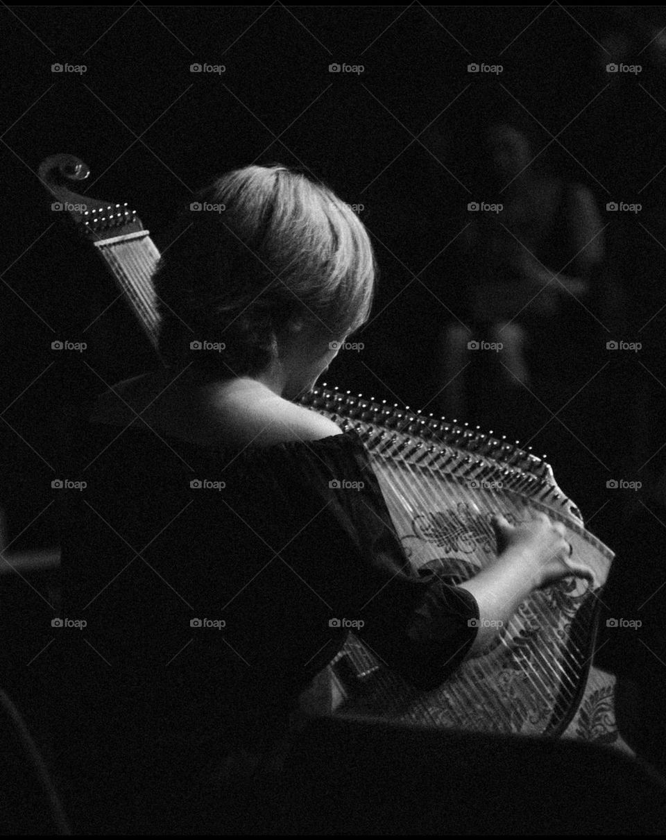 Girl playing the bandura