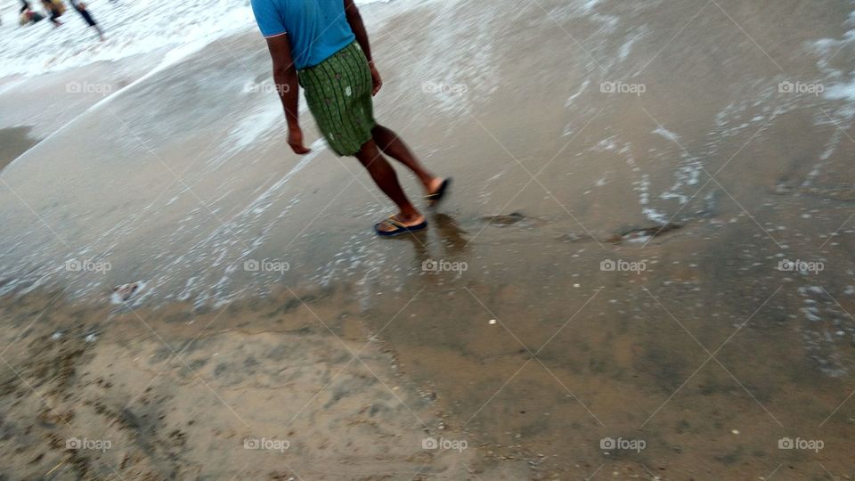man walking on the Beach