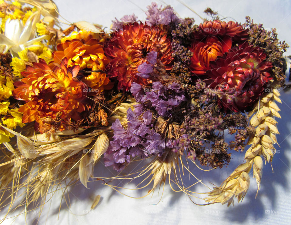 a bouquet of dried flowers and poppies on holiday