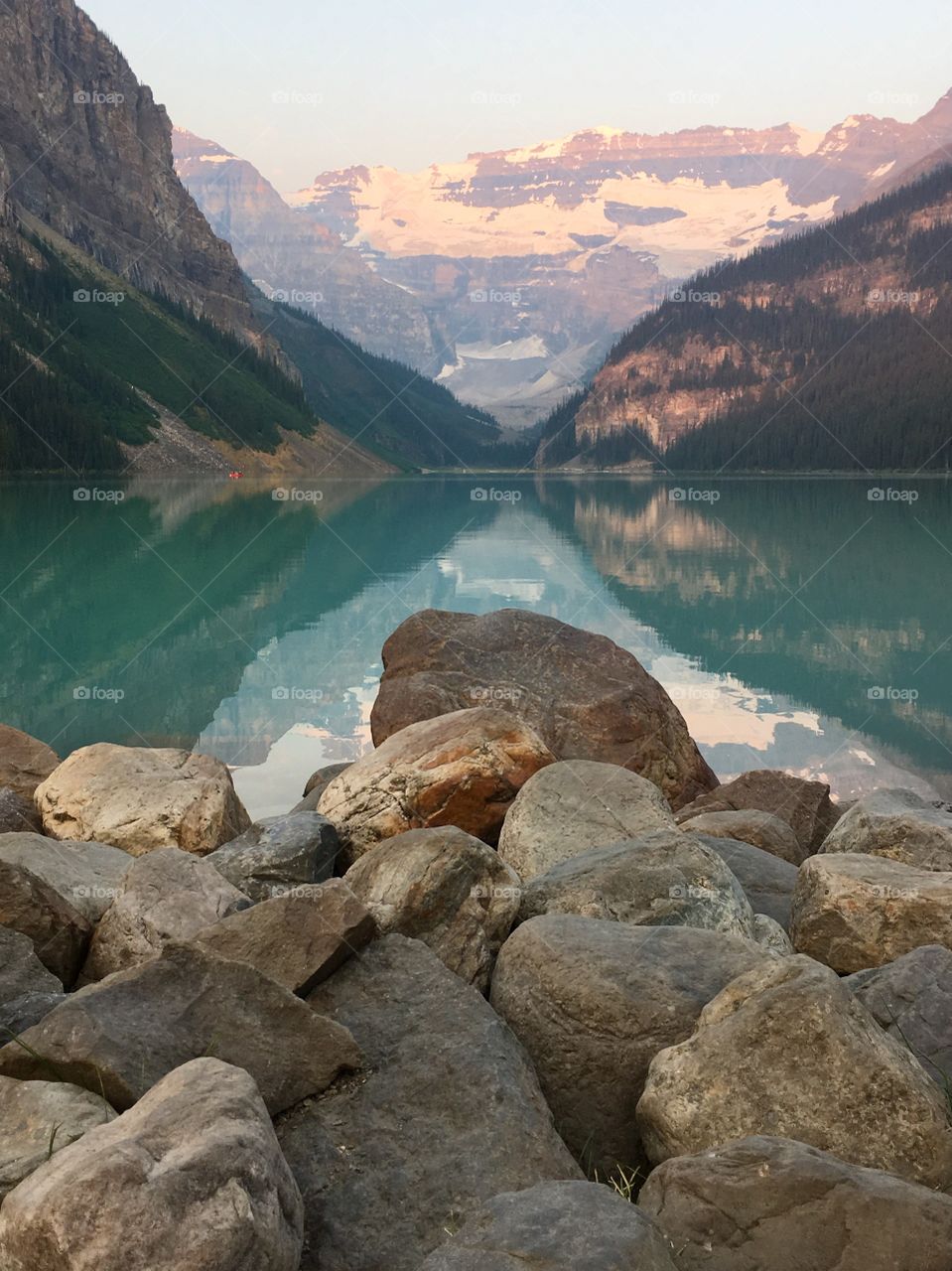 Stunning Lake Louise at Banff National Park in Calgary, Alberta; glaciers, snow capped mountains, emerald water, reflections, 