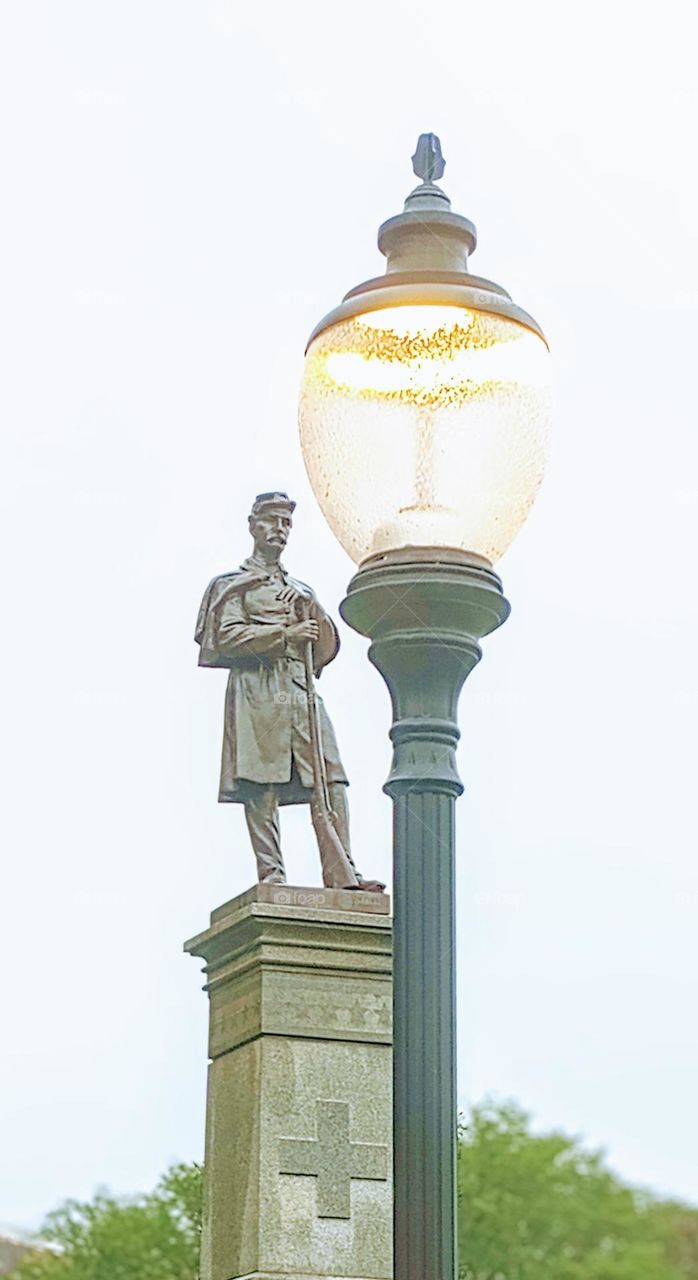 Statue and a Lamp Post