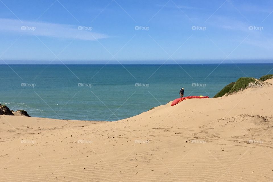 A paraglider on the beach 