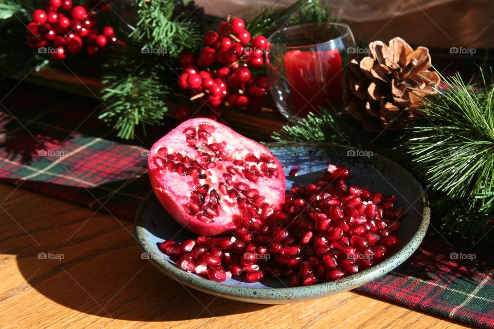 Pomegranate . Still life photo of a cut pomegranate at Christmas. 