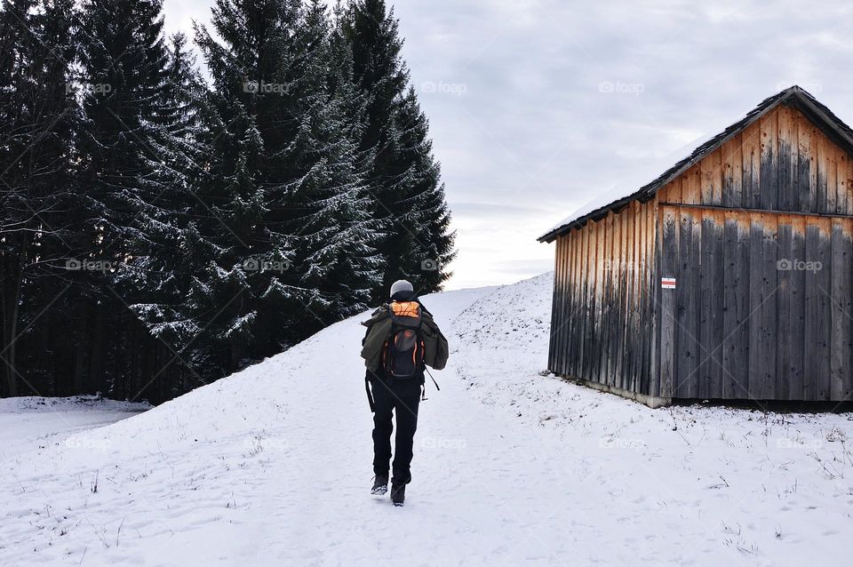 Photo of a young man hiking in the mountains 