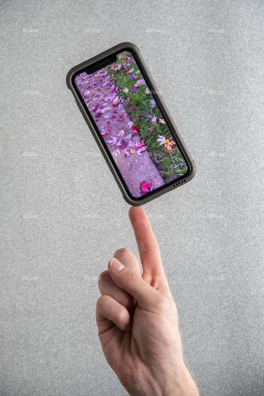 Phone balancing on a Finger