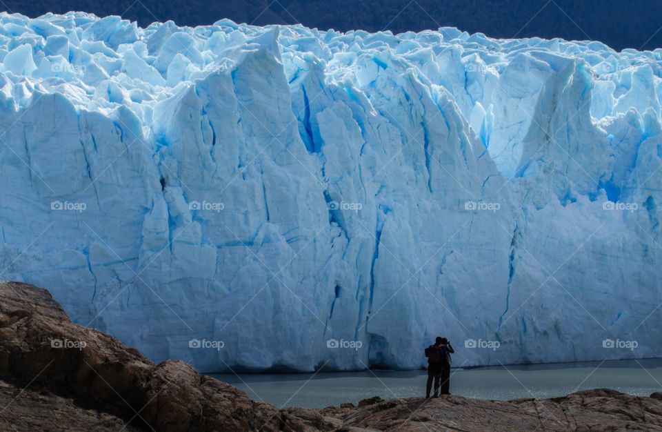people behind perito moreno glacier