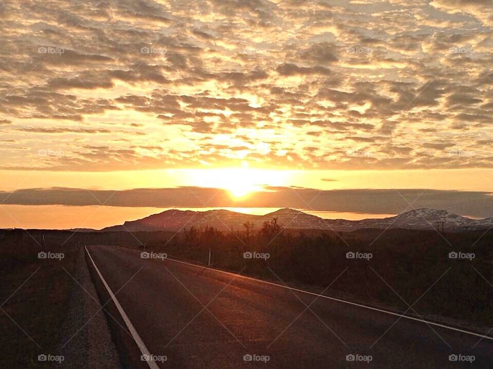 Sunset over the road