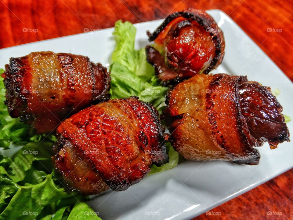 Dates wrapped in bacon