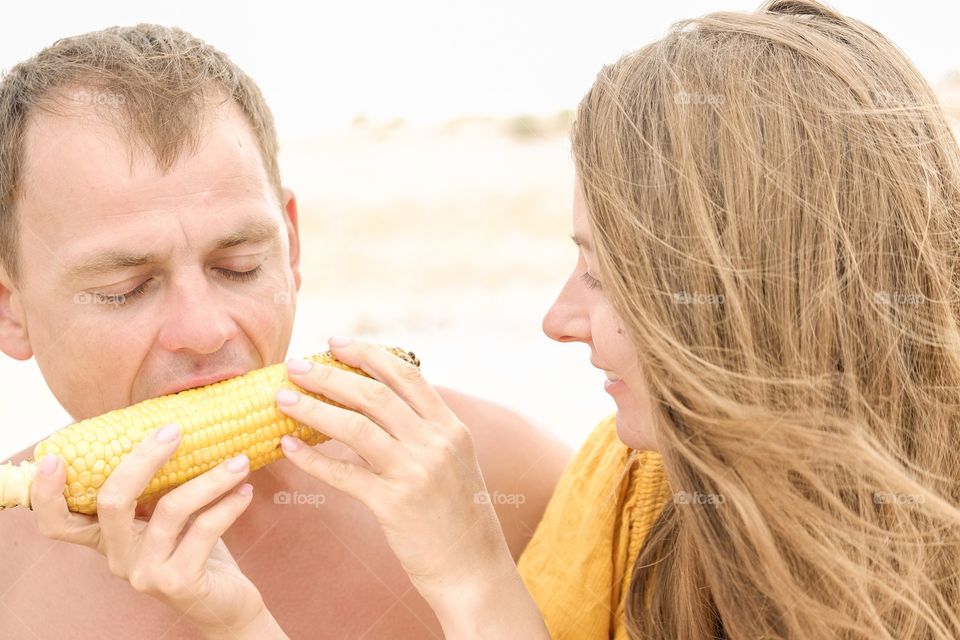 People eating corn 