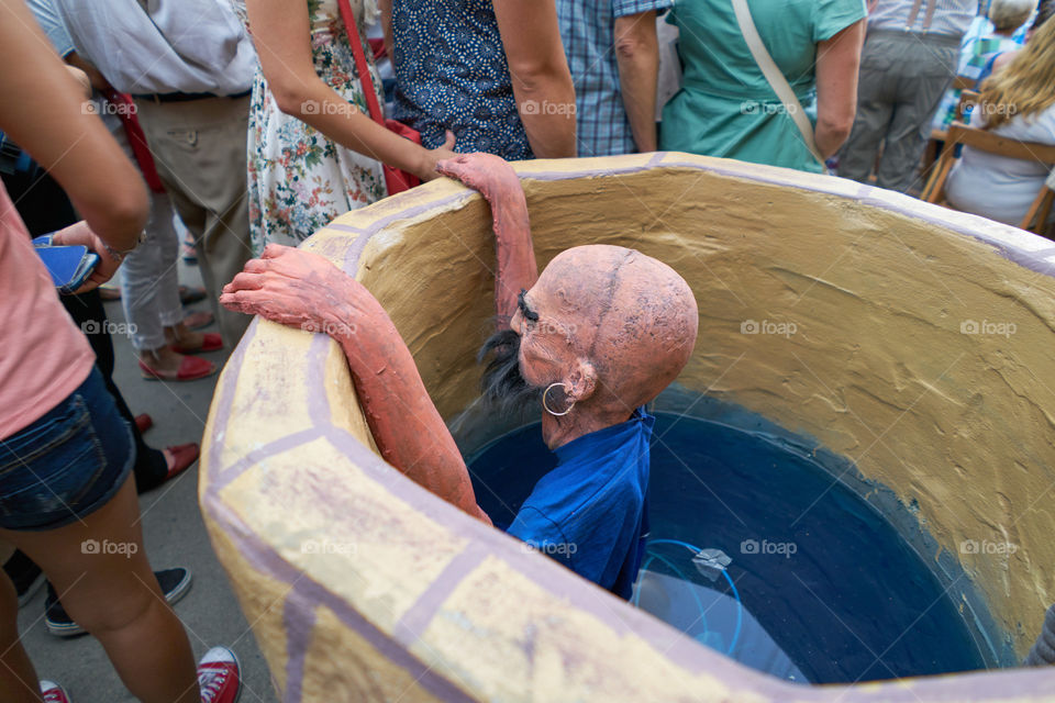 Death pirate coming out of a well. Street decoration. Fiestas de Gracia. 