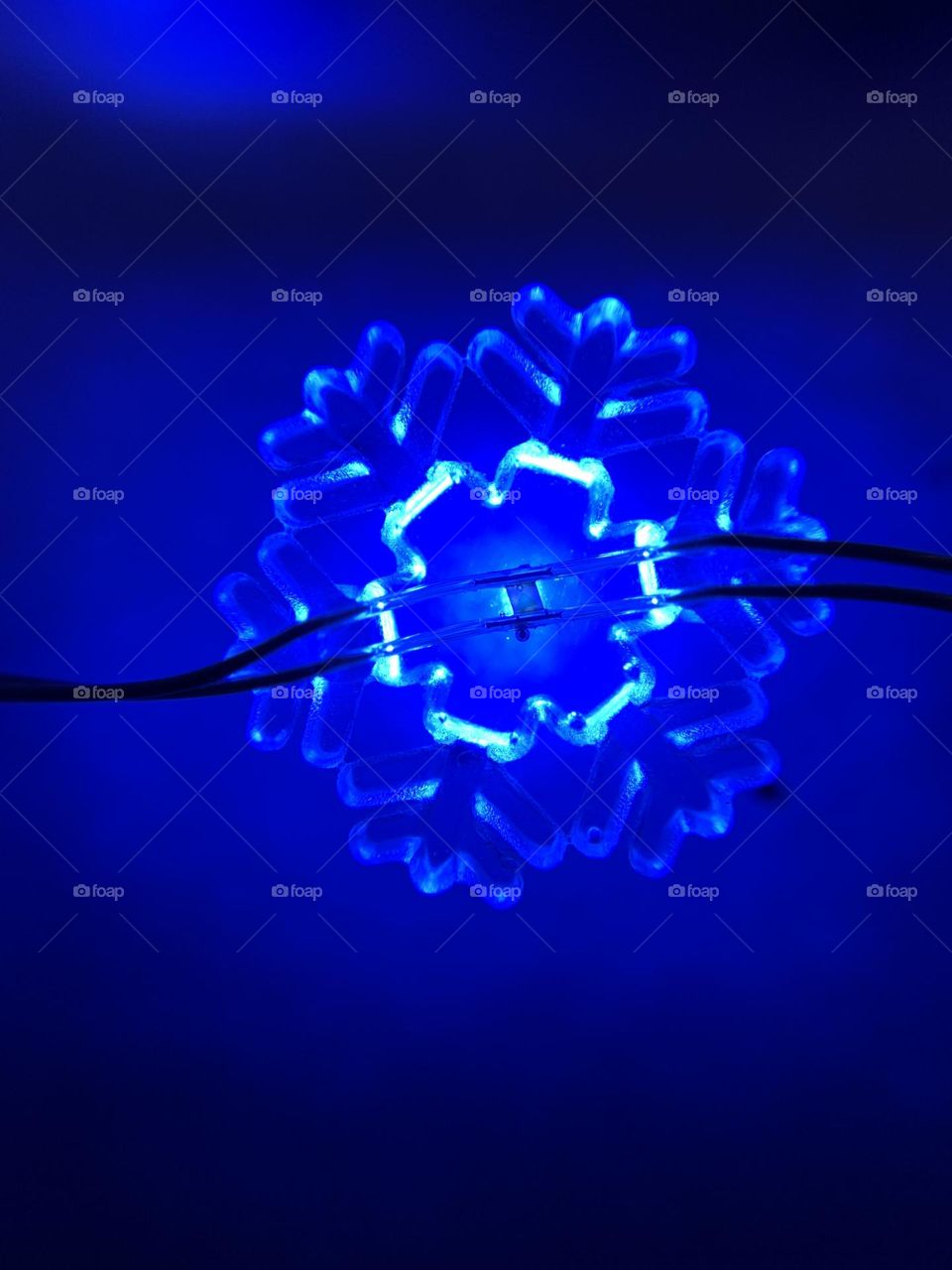 Macro lens fun. A snowflake LED light, up close. Brilliant blue lights for the holidays!