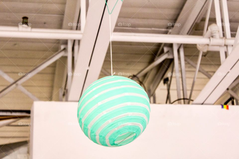 Green object hanging in office