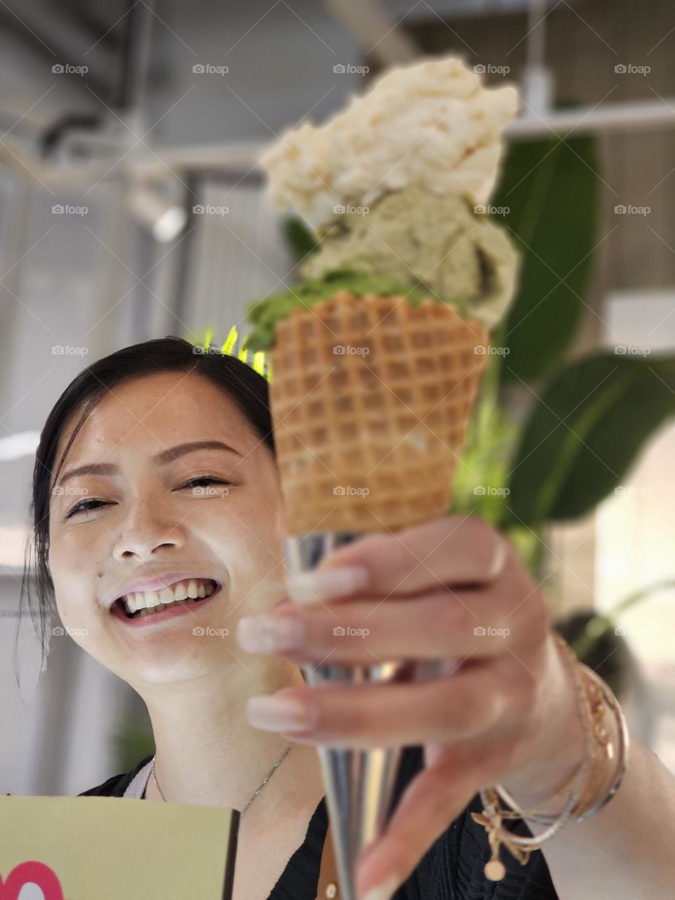 Youthful smile handing out gelato