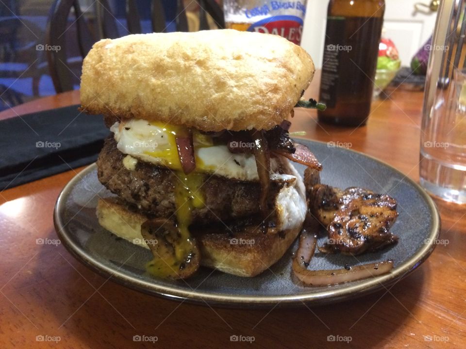 Homemade bacon blue cheese burger with egg, Sautéed onions & mushrooms, fried sage, chipotle aioli on toasted ciabatta. 