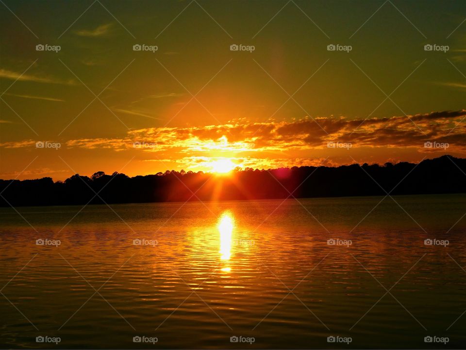 Bright sun rays peeking through the clouds