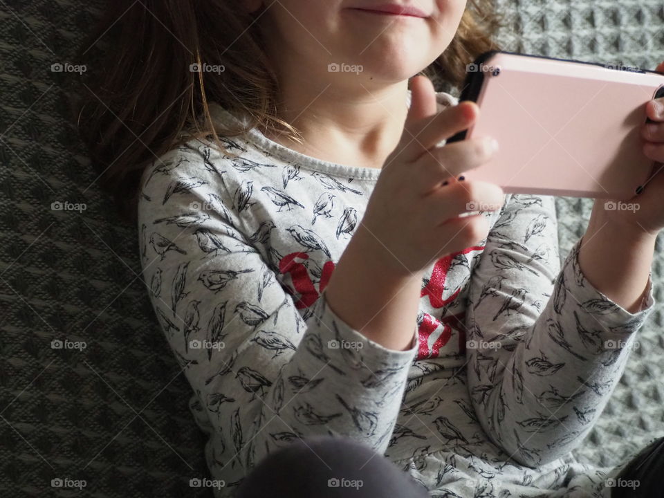 Preschool girl using technology