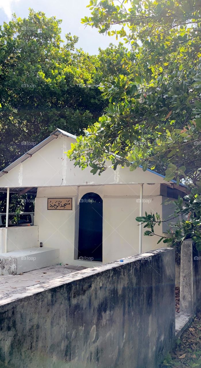 An old mosque, masjid Al Waheed, in an abandoned island in Thaa Atoll, Maldives. Visiting Muslims still pray and take care of the mosque.