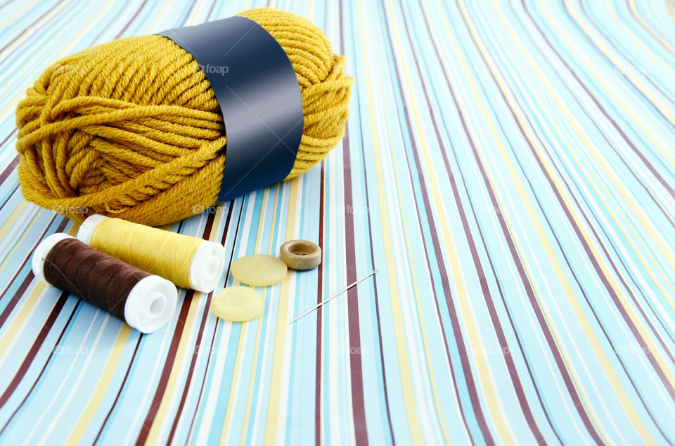 Close-up of ball of  wool and needle