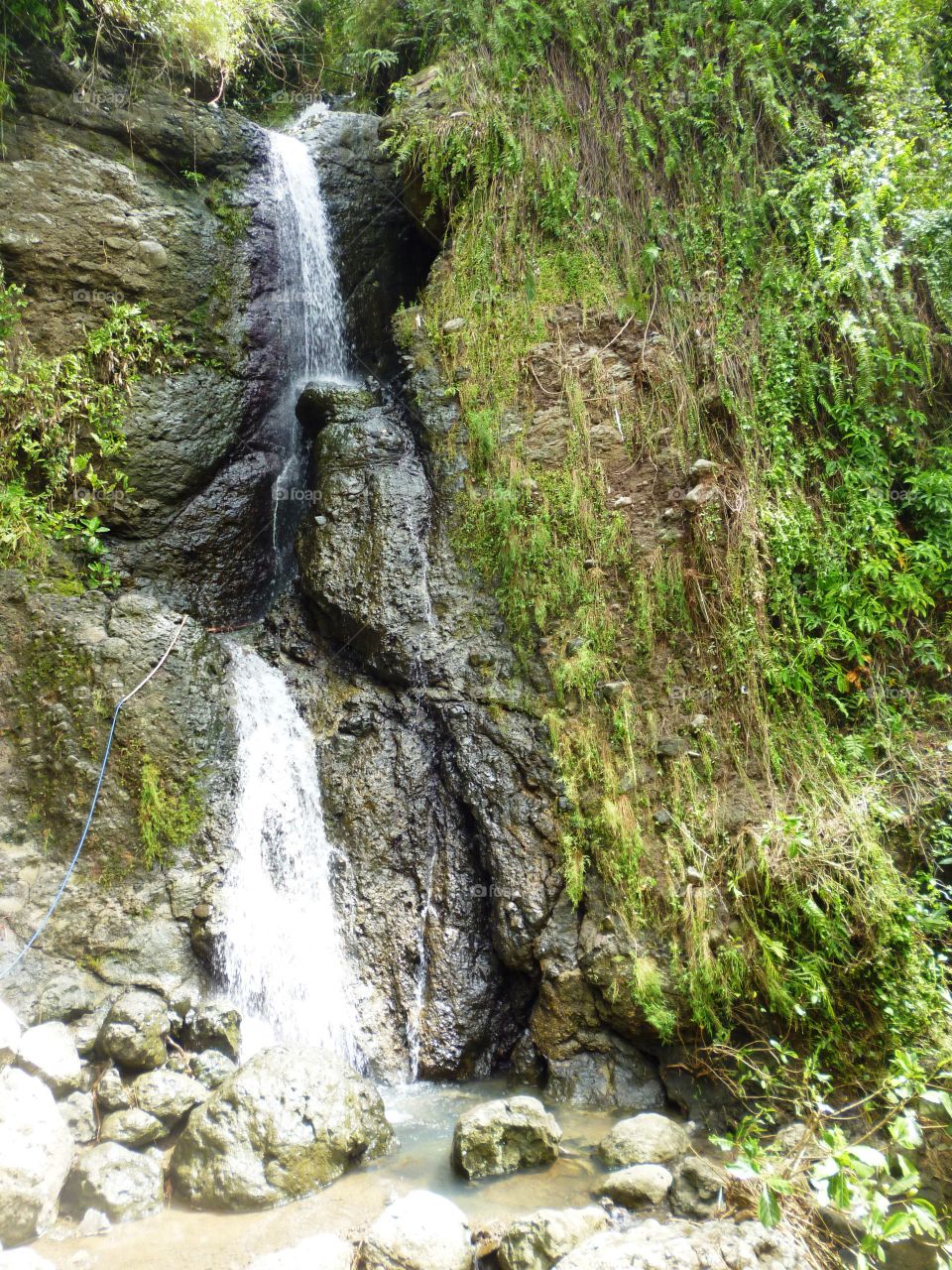 waterfall inside a village