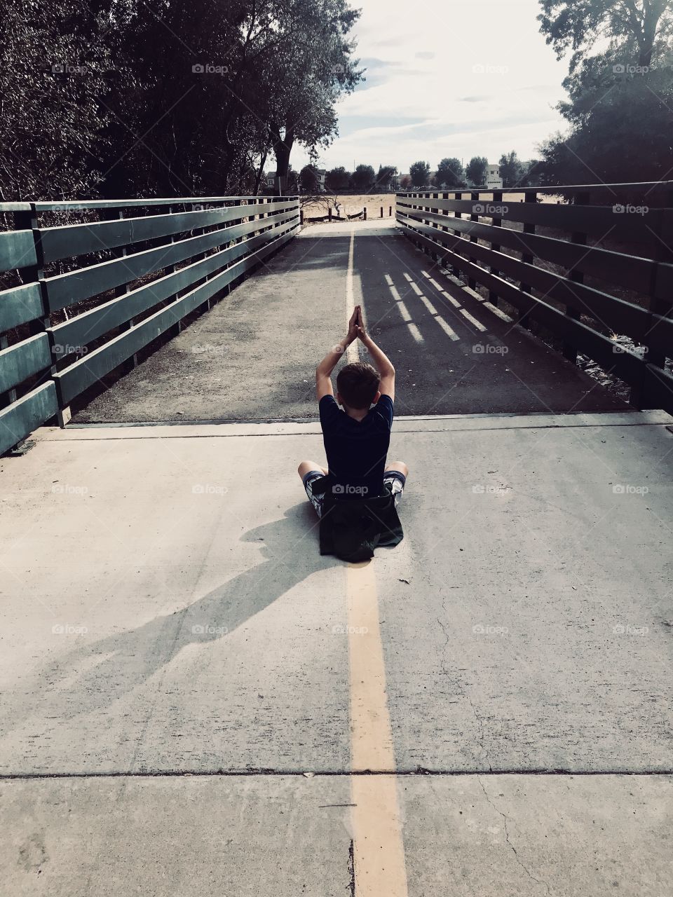 Outdoor yoga -  hold doing meditation and yoga pose outside in nature - USA, America 