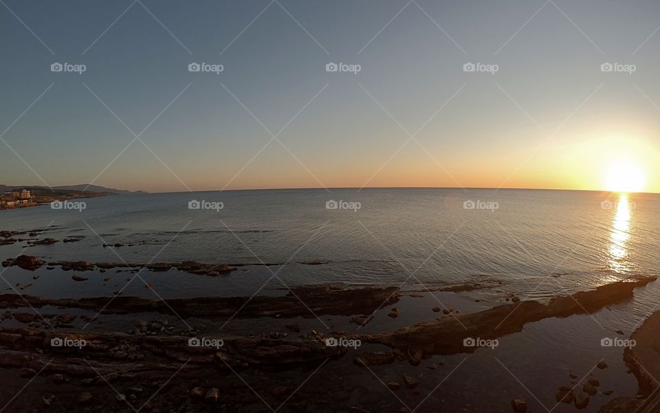 sunset over the sea horizon