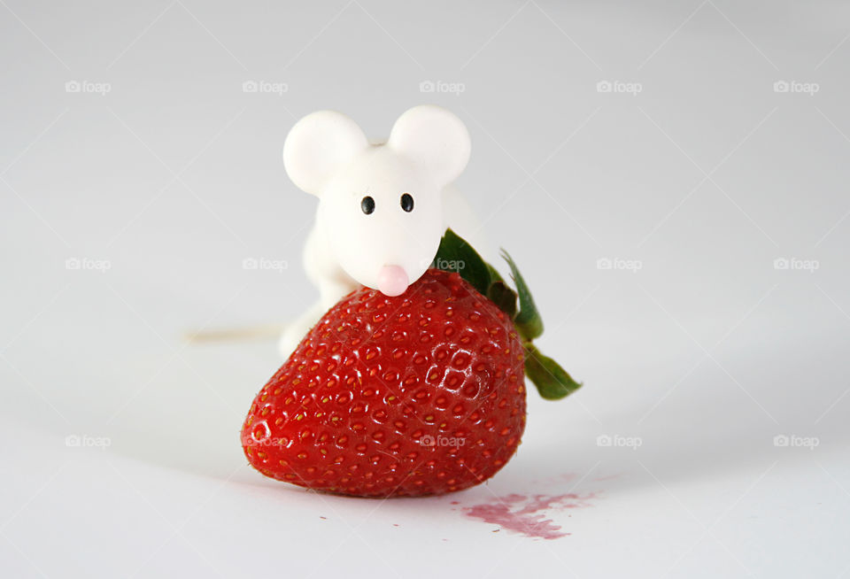 Strawberry and toy mouse