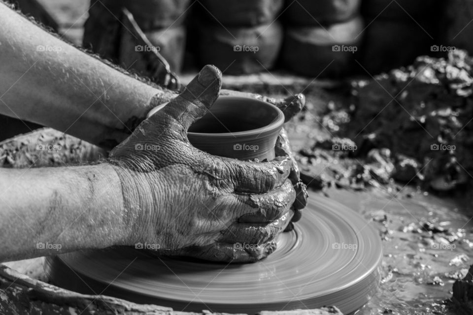 Potter hand working with clay